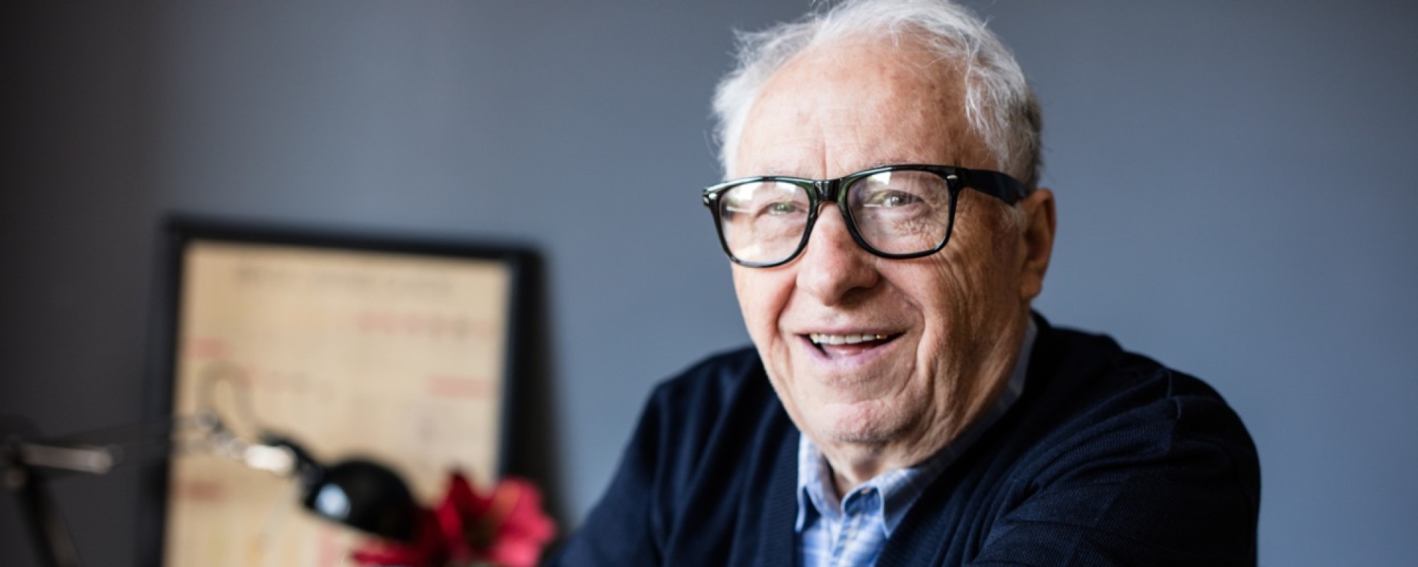 An elderly man in a classroom 