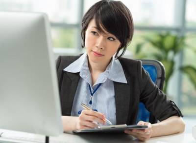 A woman working on the computer