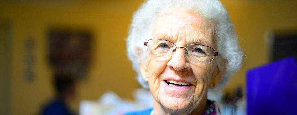 Elderly women with a smile on her face