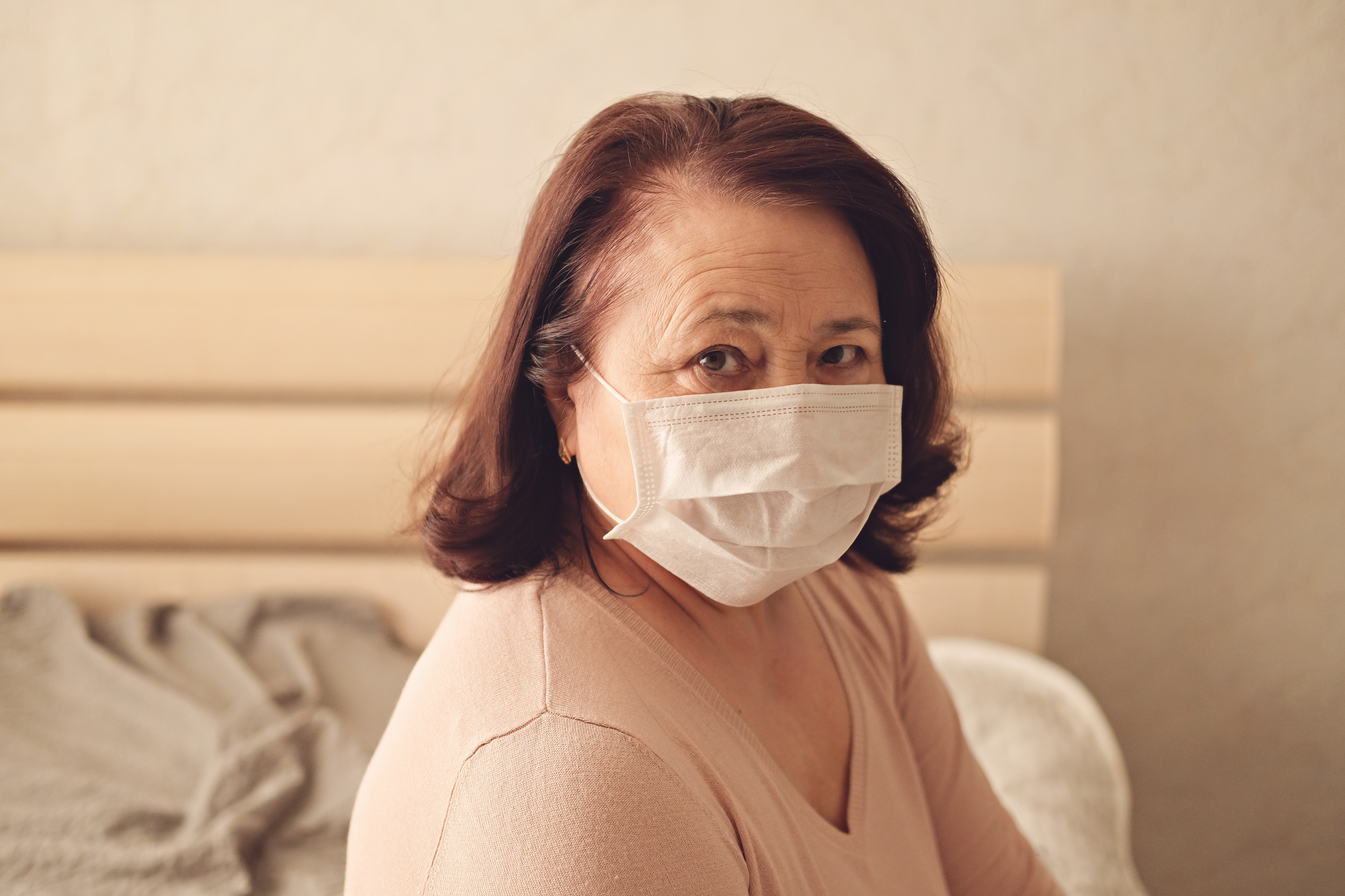 older adult women wearing a face covering 