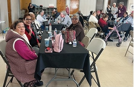 Seniors enjoying Meals on Wheels social