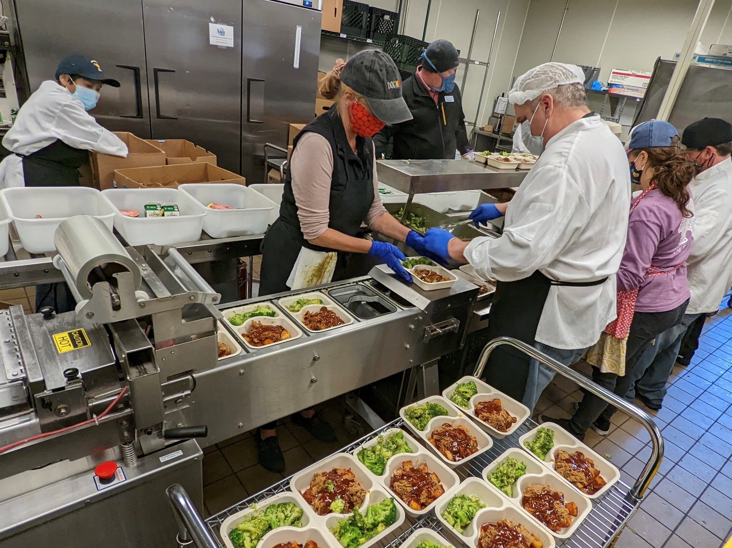 Workers preparing meals at MOWMP