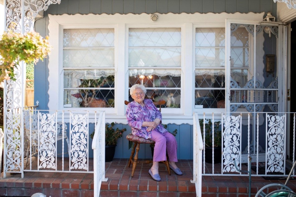 Marjorie Ritchie in front of her home