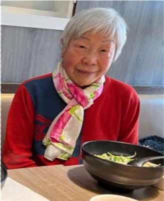 Chao Fong enjoying her bow of food at CHAMPSS restaurant